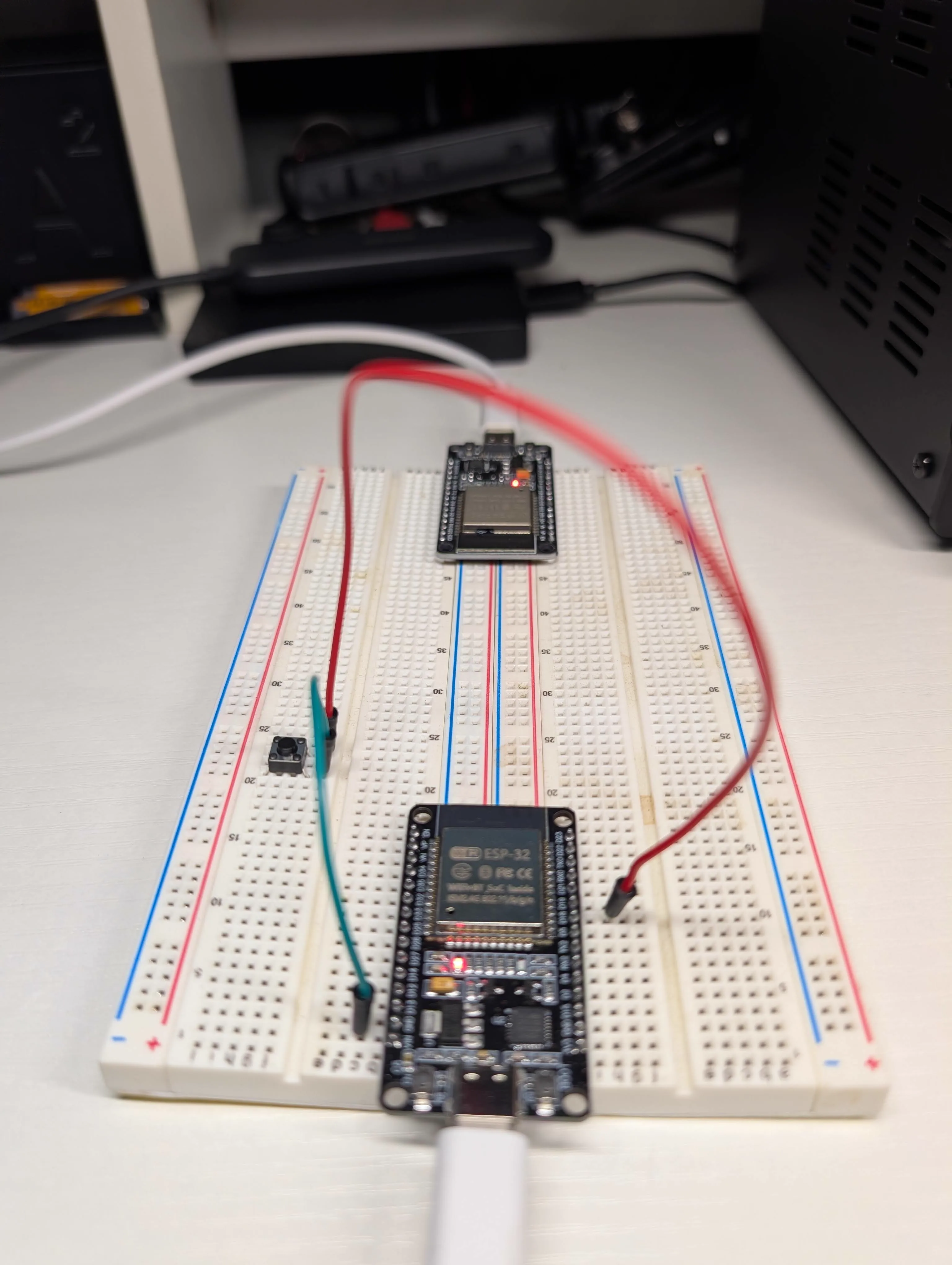 Dual ESP32 setup with physical button wired for transmitter input test