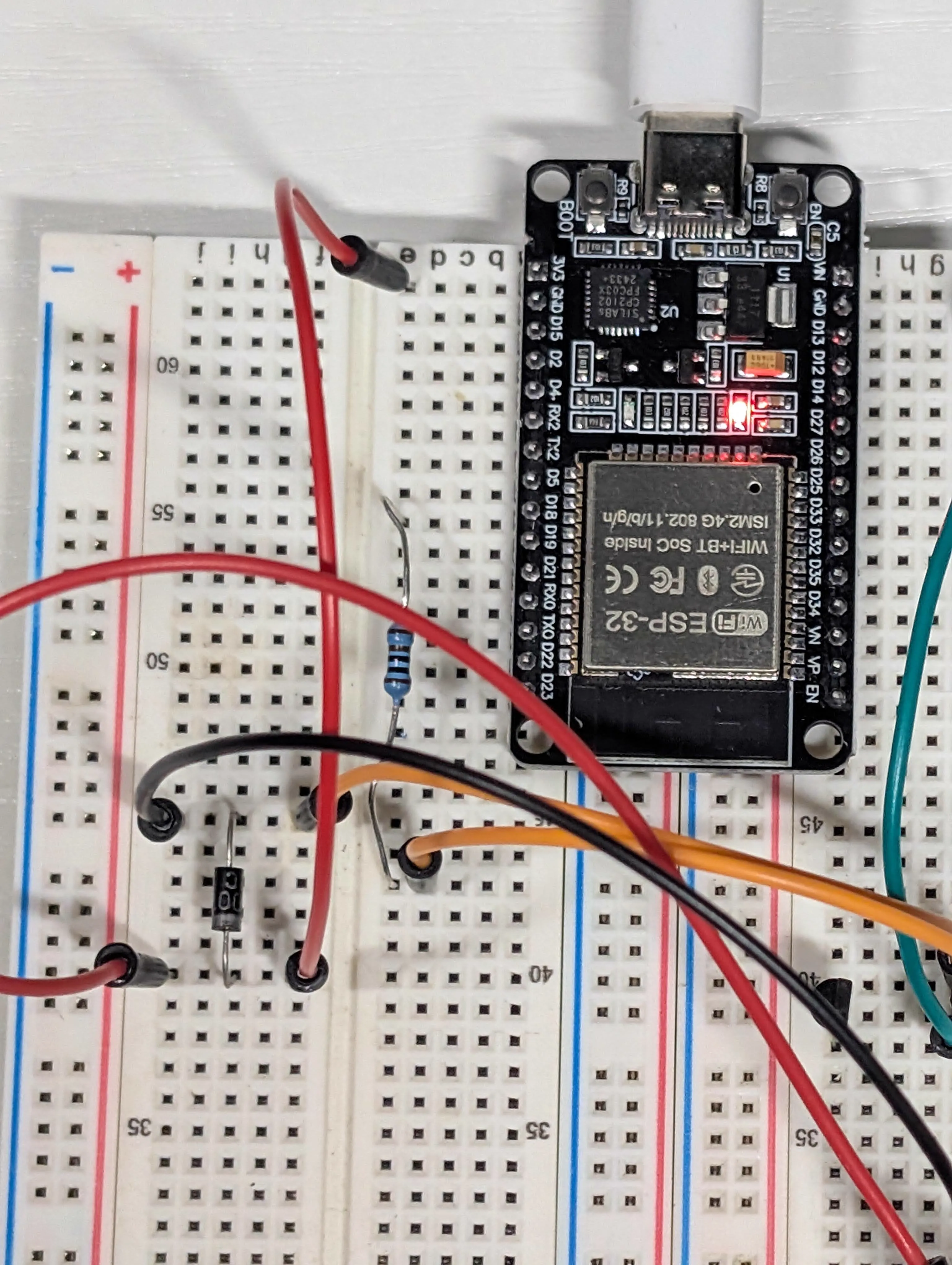 Close-up of receiver-side ESP32 wiring with transistor stage and signal wiring visible