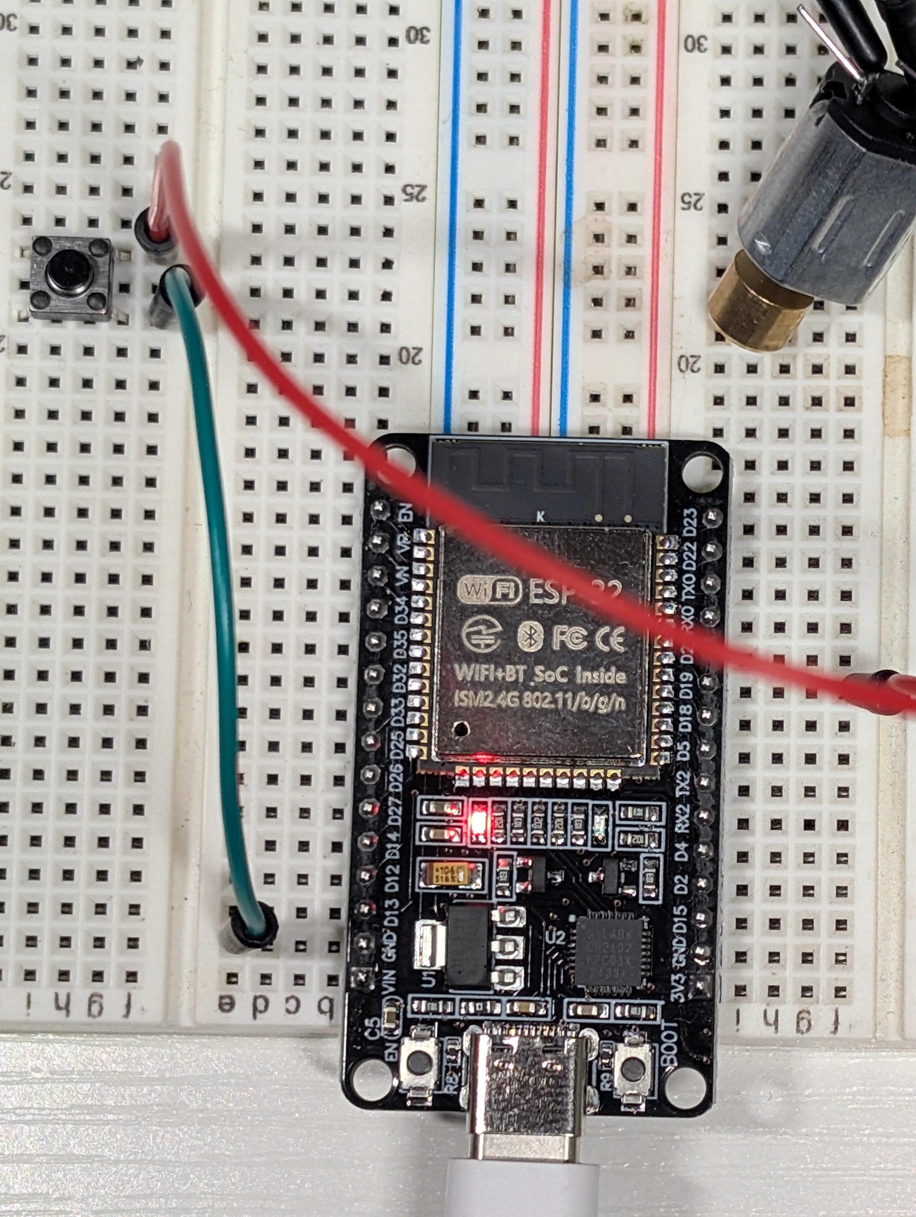 Close-up of transmitter-side ESP32 wiring with button input path visible