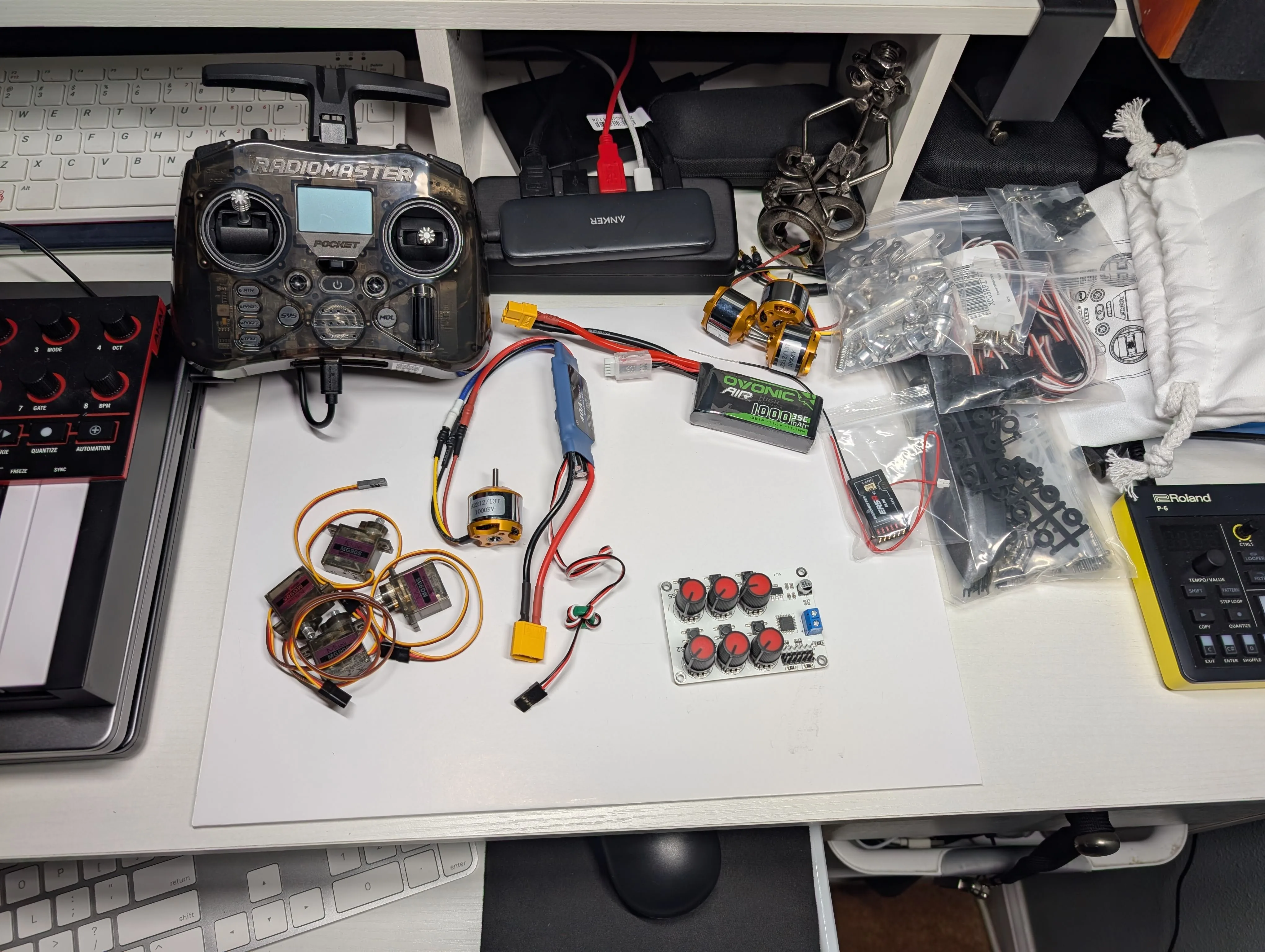 Full fixed-wing RC parts layout showing motor, ESC, receiver, servos, and supporting components
