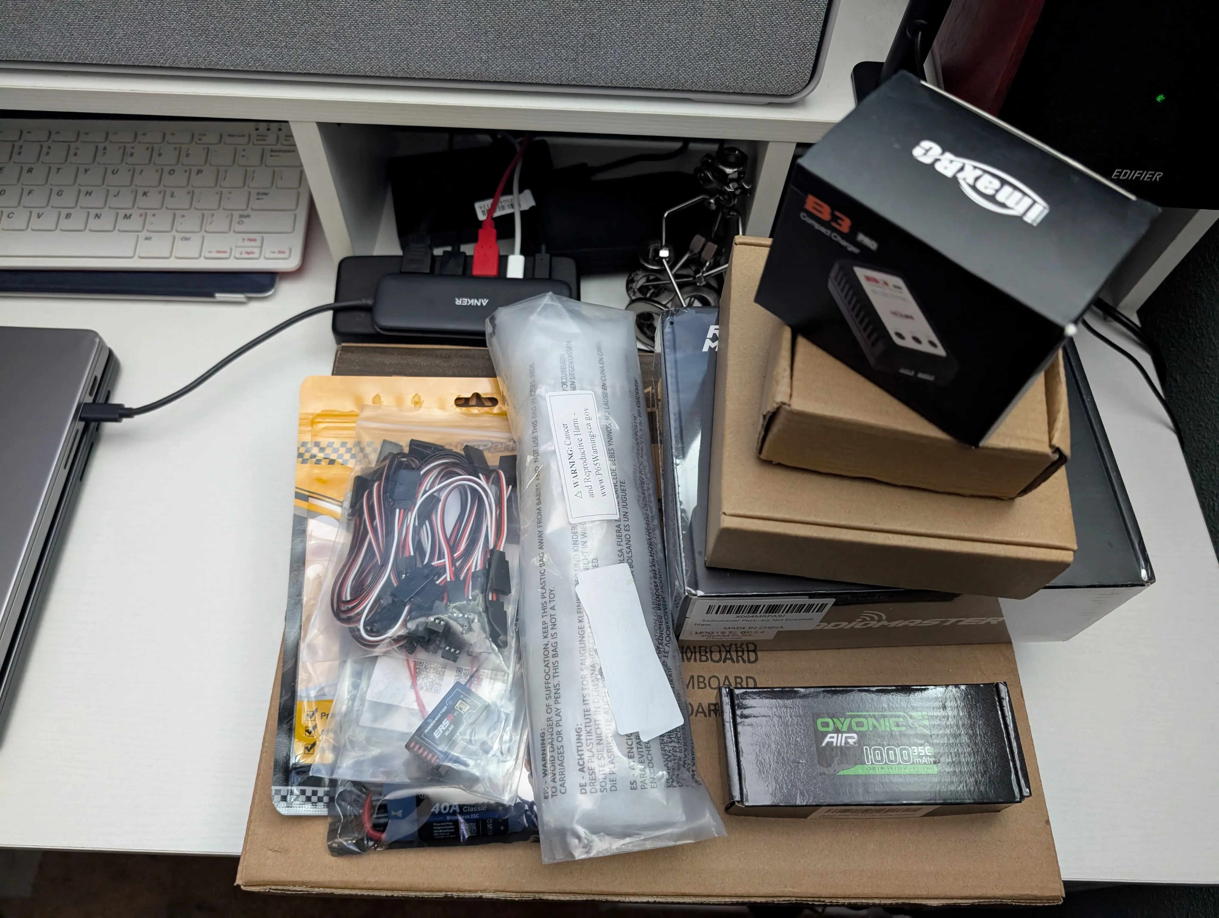 RC airplane electronics laid out on a desk after unboxing
