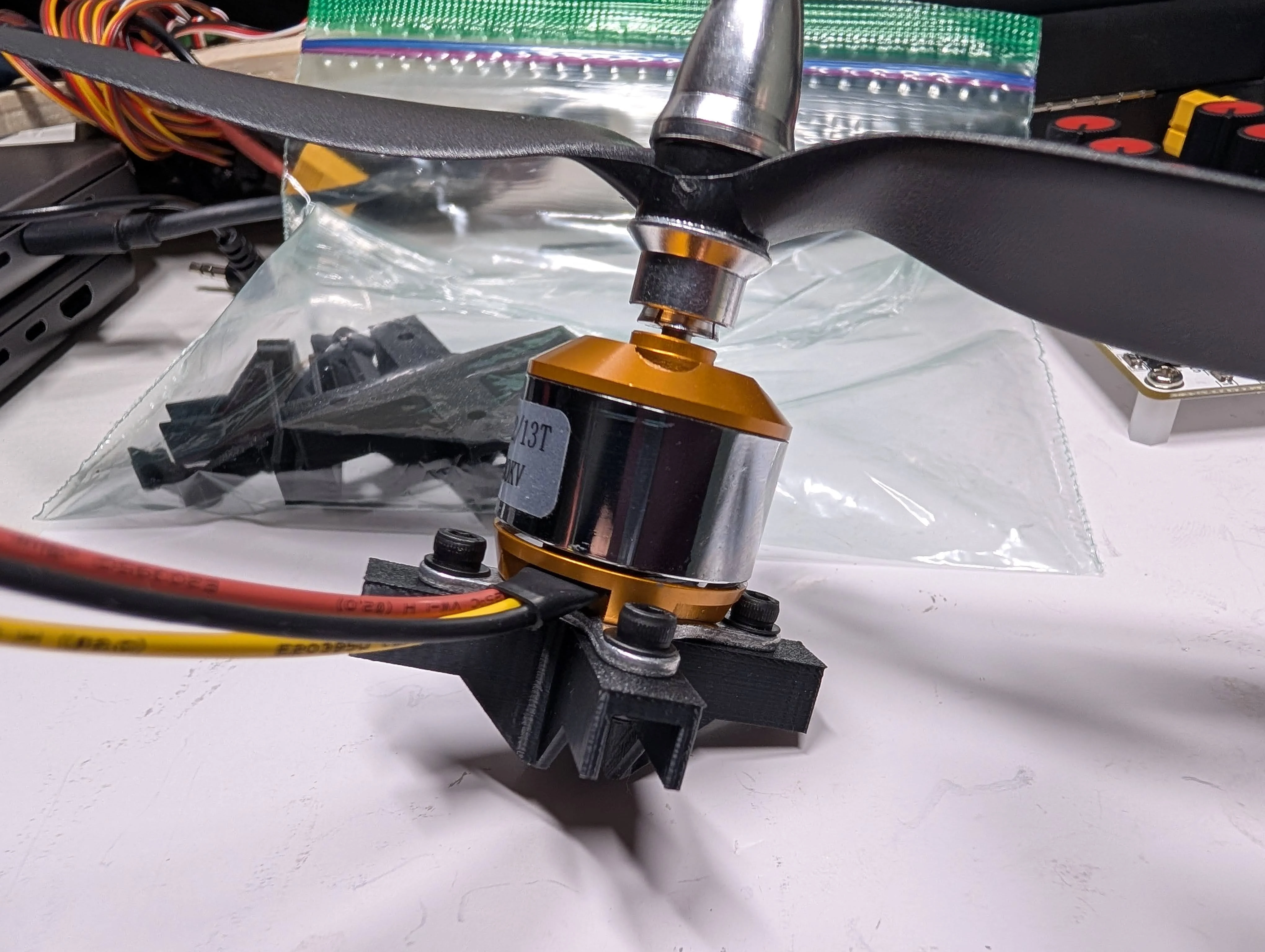 Brushless motor attached to 3D printed engine mount with bolts