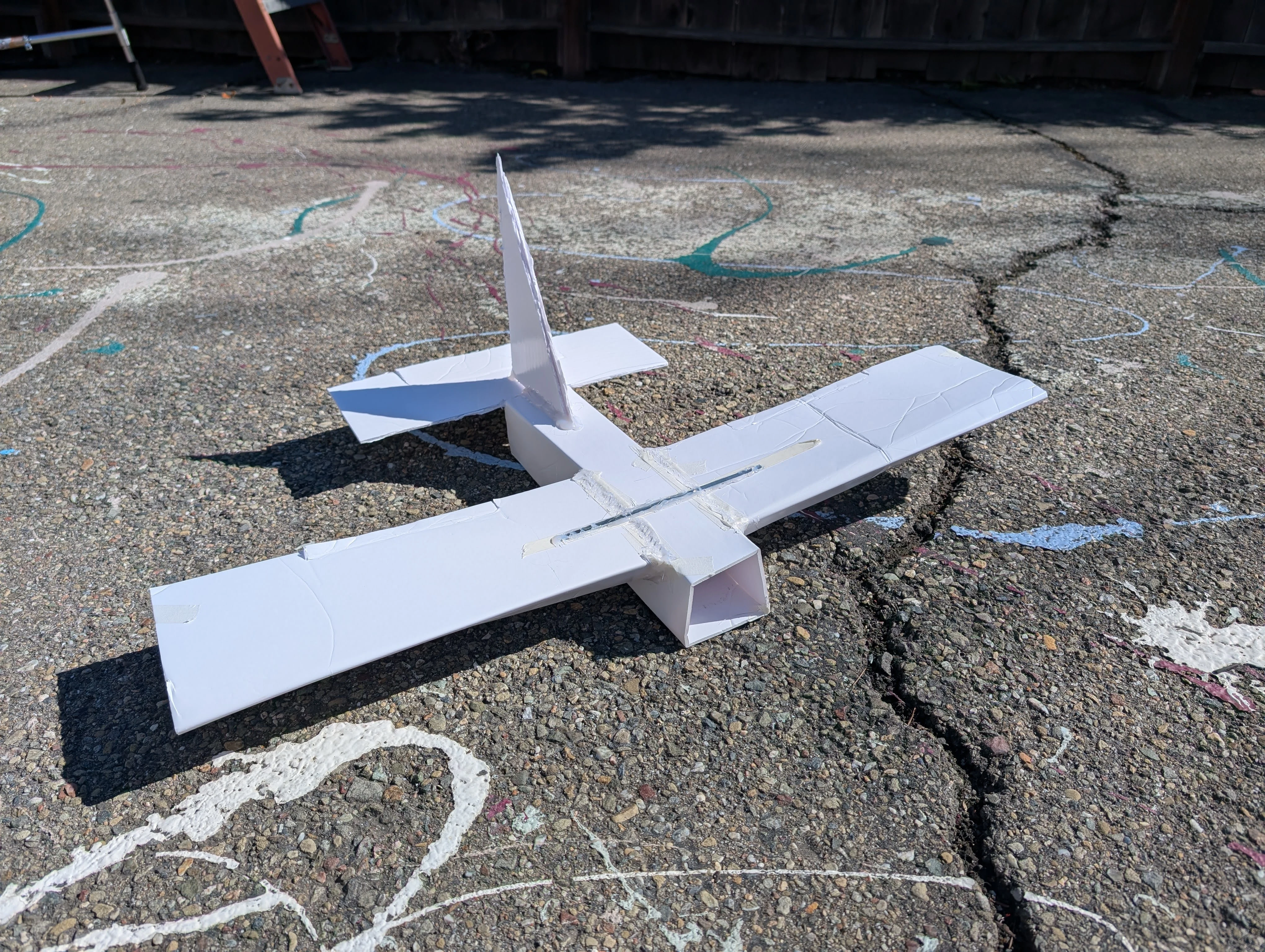 Foamboard RC airplane airframe assembled and reinforced during part three of the build