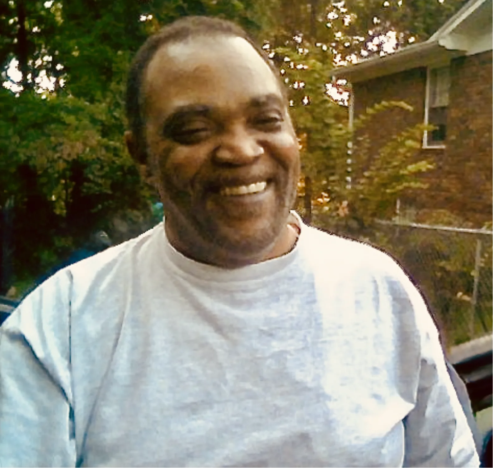 Warren &ldquo;Pops&rdquo; Blackwell Sr. smiling outdoors