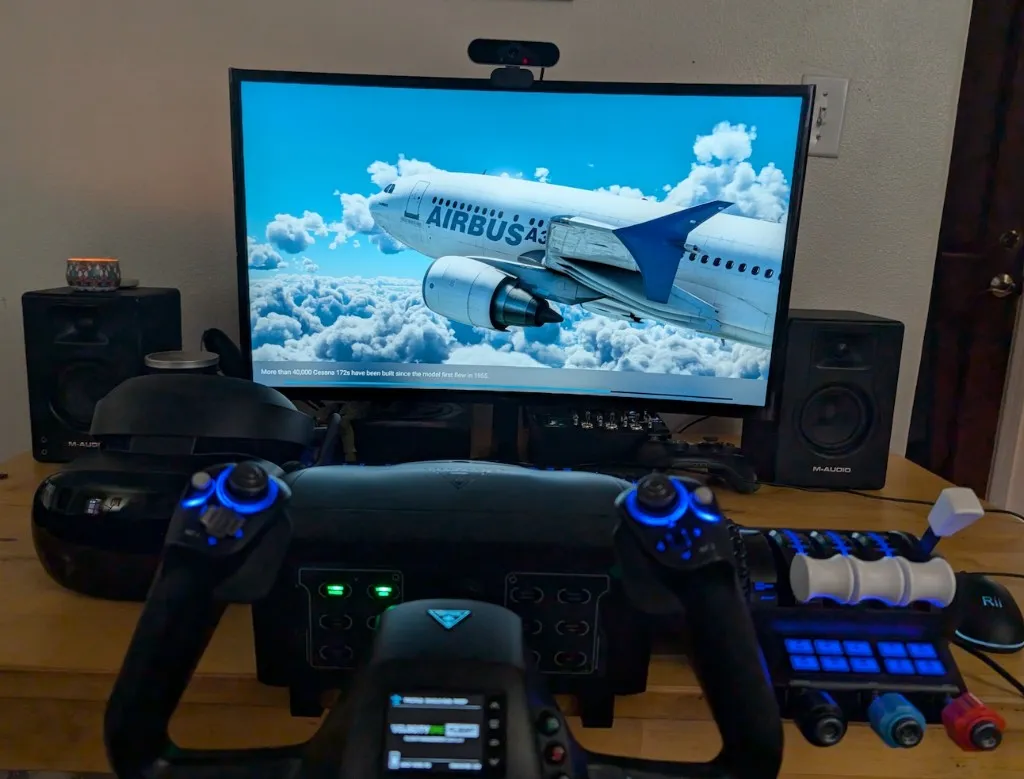 Yoke setup in front of a monitor displaying an Airbus aircraft scene in Microsoft Flight Simulator