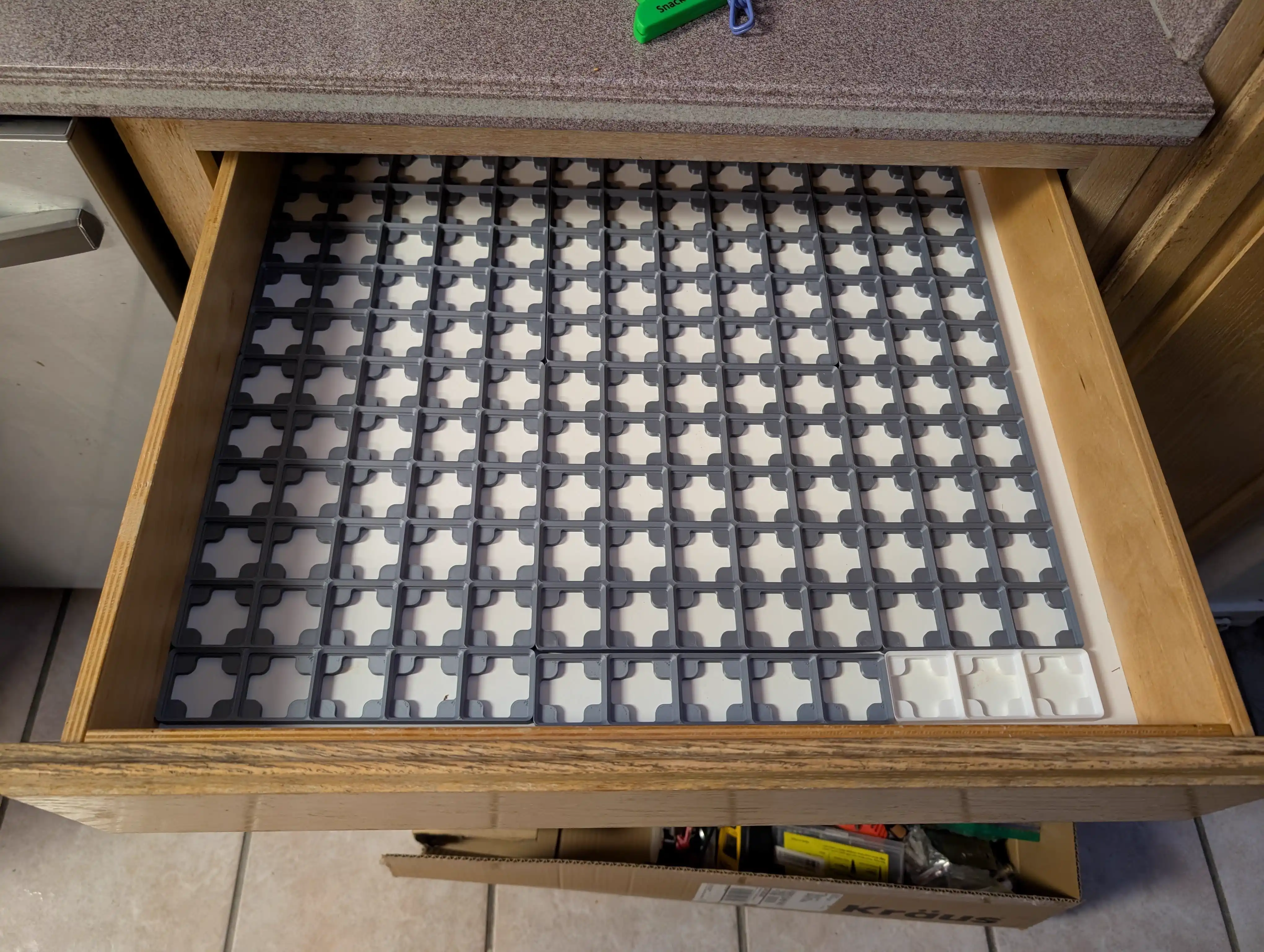 Gridfinity baseplates installed in kitchen junk drawer