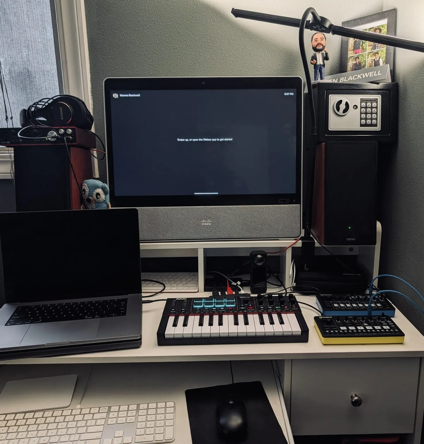 Bedroom portable music desk setup with controllers and monitors