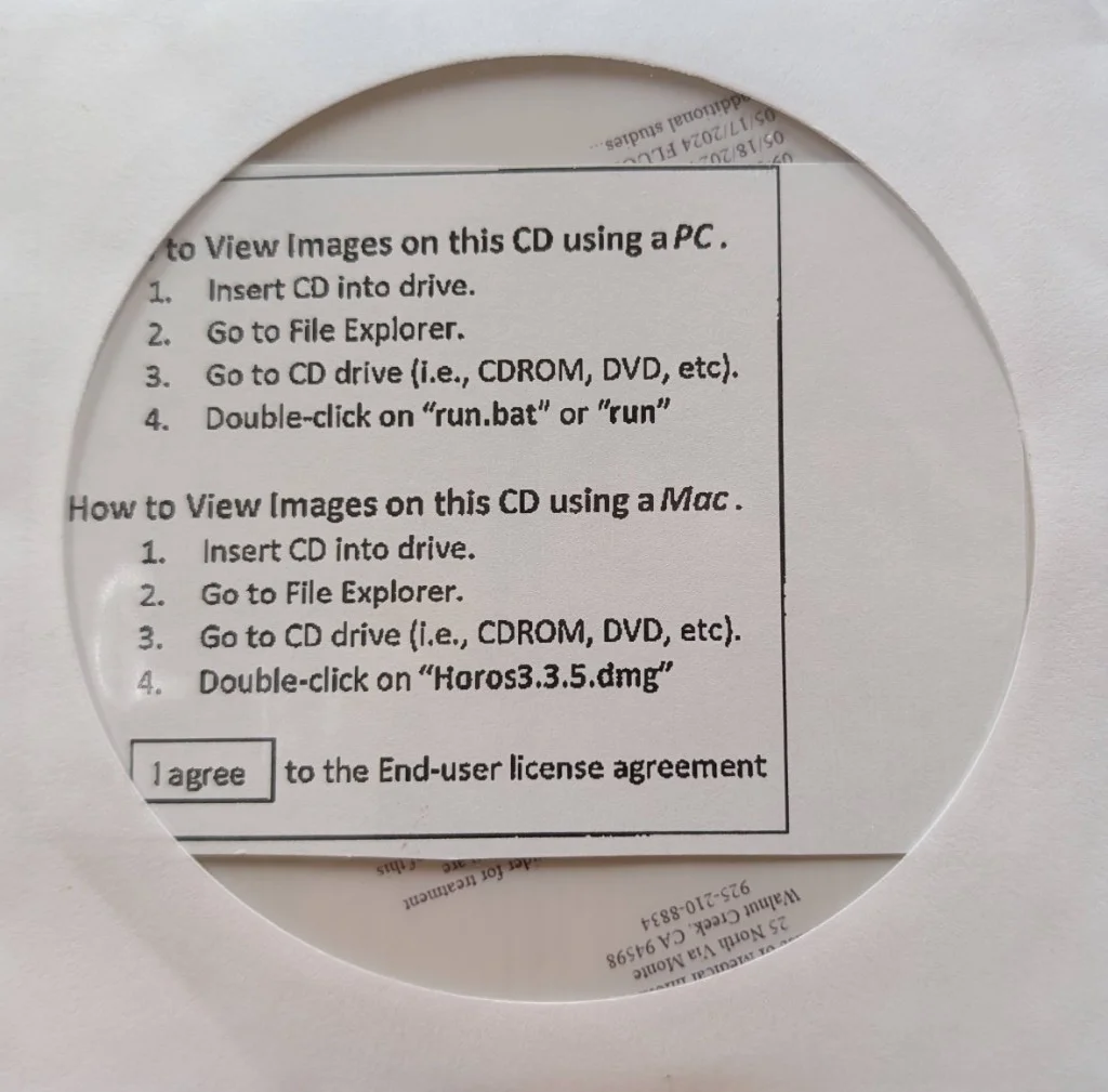 Photo of the mailed CD-ROM sleeve with instructions for opening medical imaging files on PC and Mac