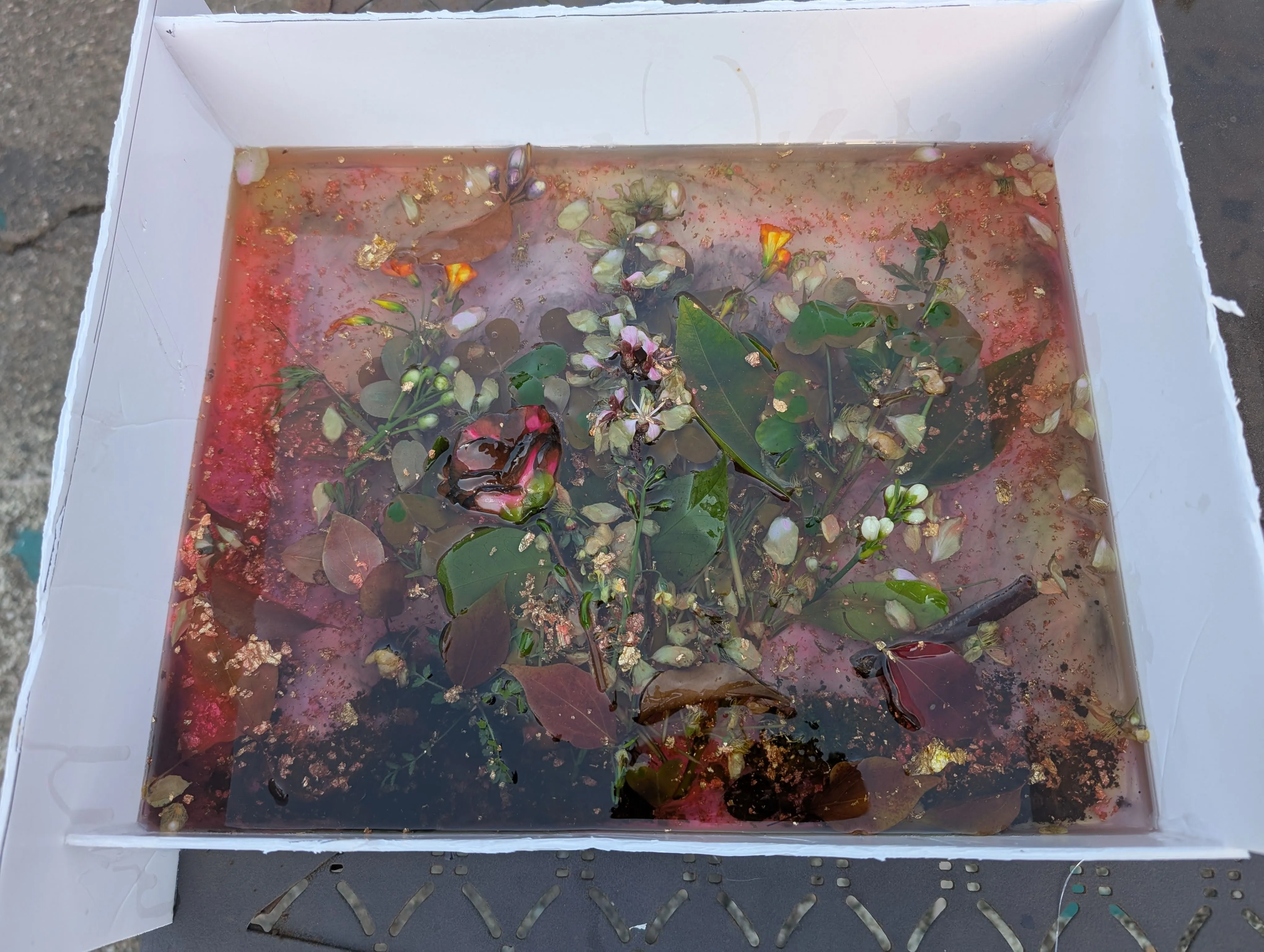 Yellow and dark smoke-colored epoxy layers added over the flowers