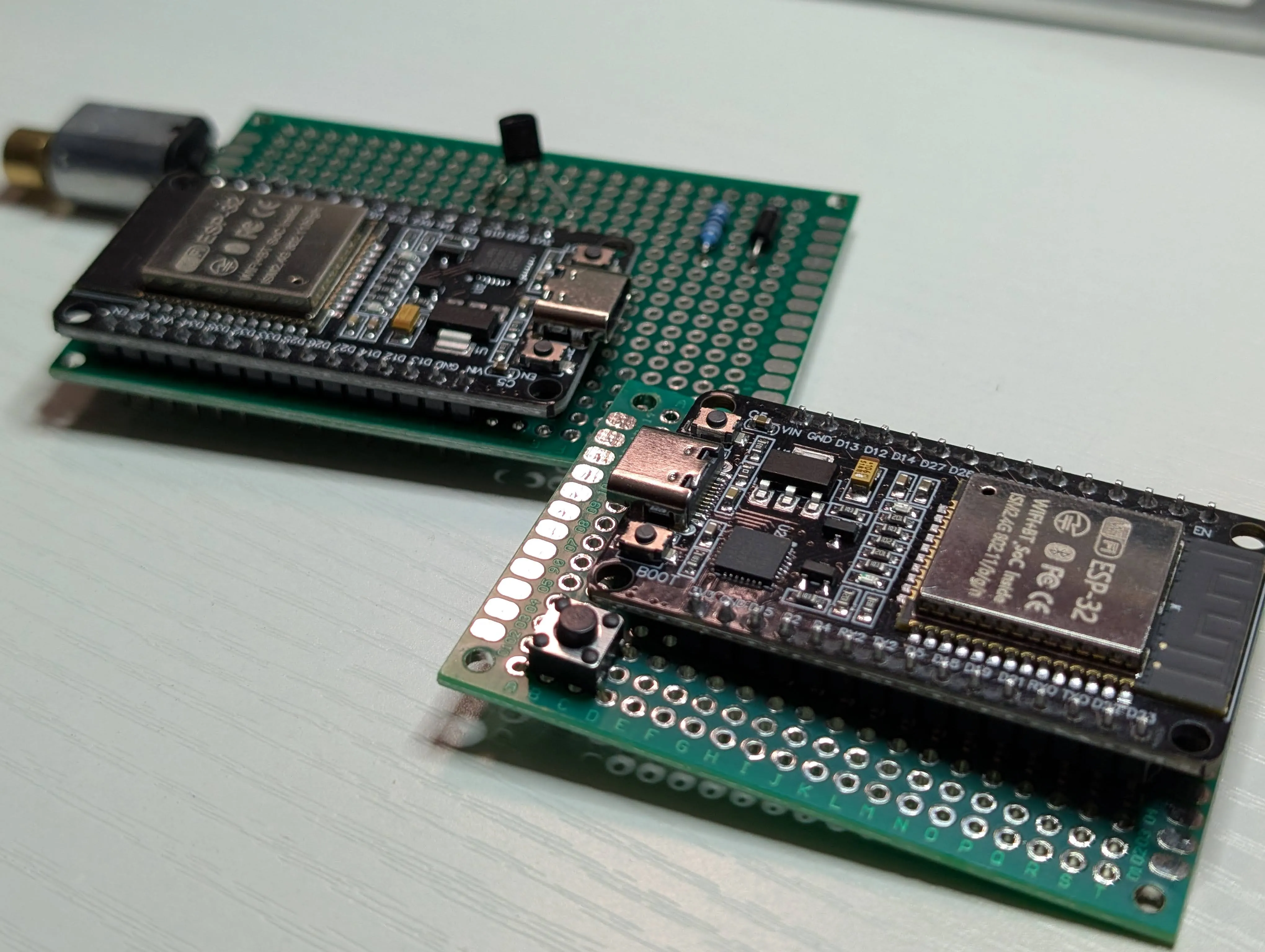 ESP32 TX board mounted on perfboard with wiring and components