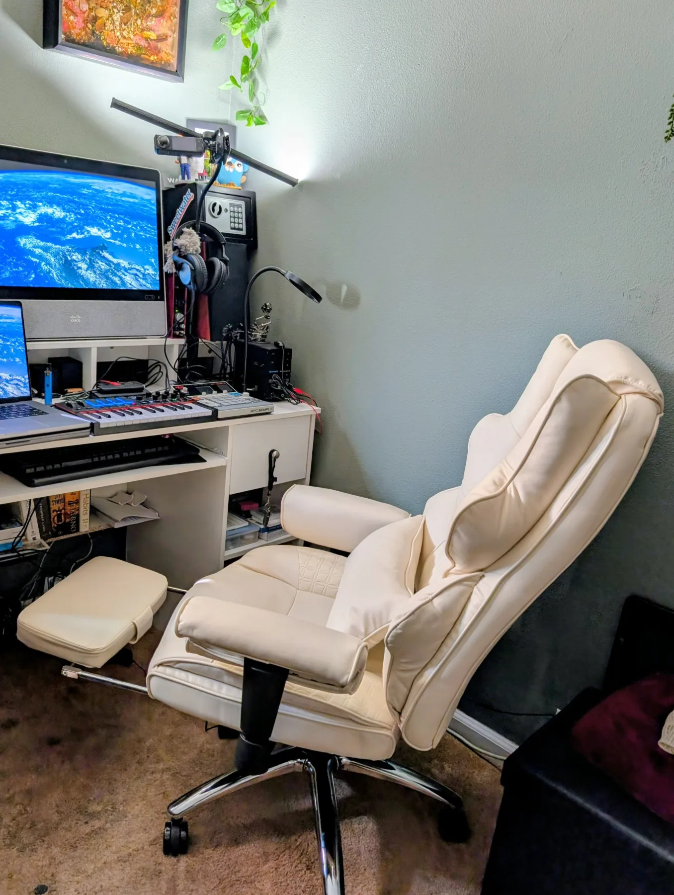 A deeply padded reclining chair positioned at Warren's computer and music desk