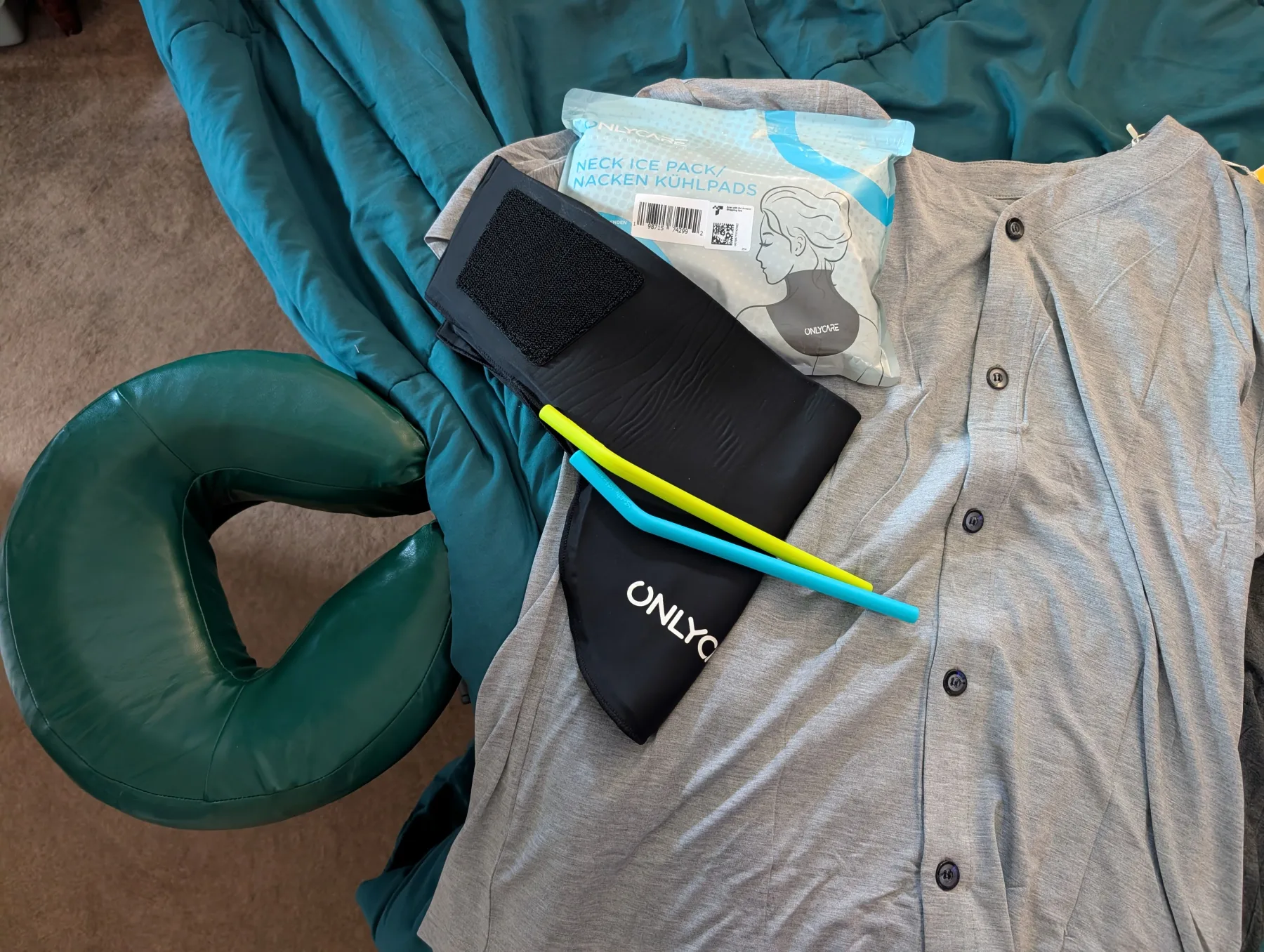 A neck support pillow and ice pack laid out on a chair